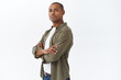 © Cookie Studio - Portrait of young confident and serious african american man, determined guy squinting self-assured staring camera in professional pose, cross arms chest, ready to help, white background