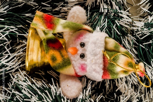 Christmas toy of an iceman on green and white decorations Tableau sur Toile
