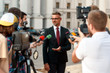 © Svitlana - What about you. Journalists conducting interview of politician. Journalism industry, live streaming concept.