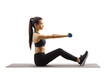 © Ljupco Smokovski - Young beautiful woman sitting on a mat and exercising with dumbbells