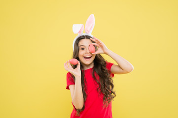 Wall Mural - Funny games. Indoor and outdoor holiday activities. Fun and educational Easter activity for kids. Little girl easter eggs. Cute cheerful bunny schoolgirl celebrate Easter day. Preparing decorations