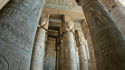 Wall Mural - Interior of the painted and carved hypostyle hall at Dendera Temple. Ancient Egyptian temple near Qena. Tilt view 4k