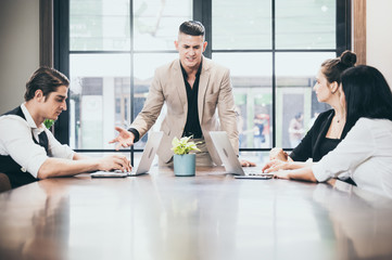 Wall Mural - Business coworkers discussing new ideas and brainstorming in a modern office