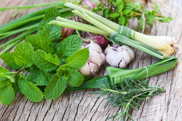 kitchen herb garden concept - Natural fresh herbs and spice on rustic wood background in the kitchen for ingredient food