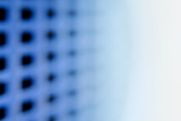 abstract macro photography. close up blue fence with square grid pattern
