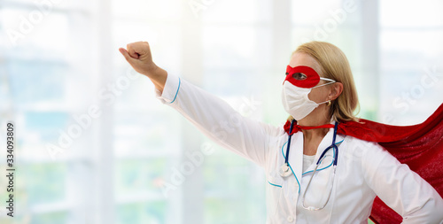 Fotografía Doctor or nurse in face mask and superhero cape.