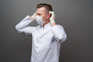 Wall Mural - Doctor wearing hygienic mask to prevent infection