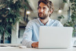 © fotofabrika - Businessman in shirt working on his laptop in an office. Open space office