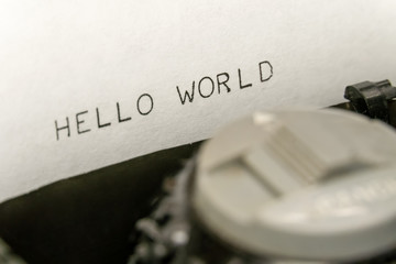 Wall Mural - Close up printed text Hello World on an old typewriter