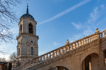 Belfry and twisted staircase of the Church of the Vladimir Icon of the Mother of God on a blue sky background