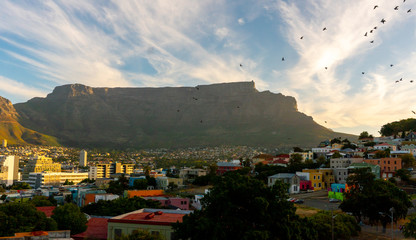 Beautiful view from Bo-Kaap or Malay at sunny day with Table Mountain on background before sunset. The city of Cape Town is a famous travel destination in Africa. February 2020