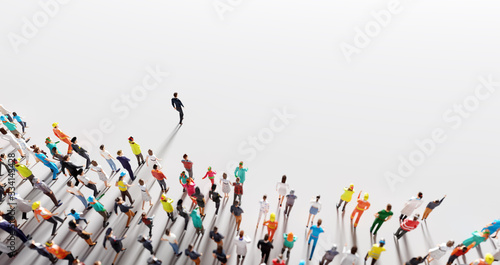 Fotografía Businessman leader leading a large group of people.