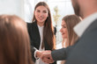 © ASDF - close up. business woman shaking hands with her colleague.