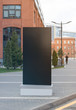 Blank black vertical pylon stand mockup brick building background