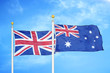© Oleksii - United Kingdom and Australia two flags on flagpoles and blue cloudy sky