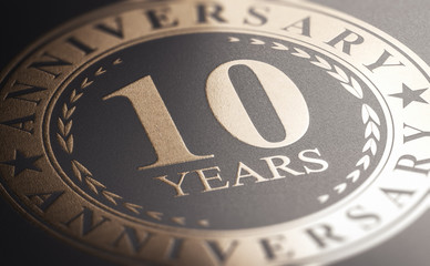 10th anniversary, golden stamp over black background. Ten years celebration card