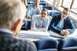 © BalanceFormCreative - College students listen to professor's lecture in class room.