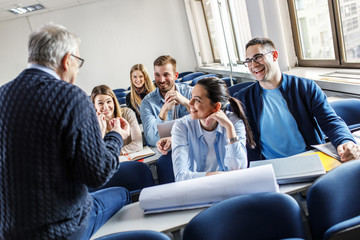 college students listen to professor's lecture in class room.