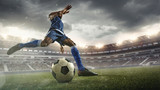 Fototapeta Sport - Professional football or soccer player in action on stadium with flashlights, kicking ball for winning goal, wide angle. Concept of sport, competition, motion, overcoming. Field presence effect.