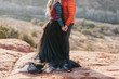 couple holding hands during adventure desert elopement