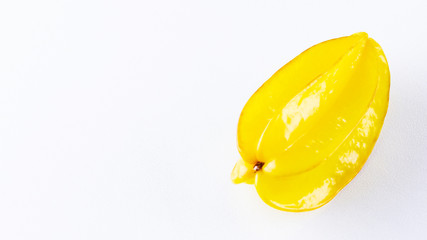 Wall Mural - Carambola on the white background. Star Fruit (Averrhoa carambola L.) with copy space. Yellow fruit carambola. Top view