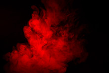 Colorful Smoke Close-up On A Black Background. Red Cloud Of Smoke.