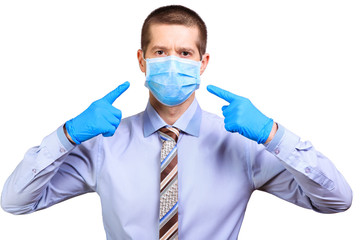 Wall Mural - Man in rubber gloves shows on medical mask, in shirt and tie, isolated