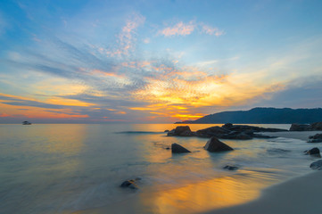 Wall Mural - Beach rock and sunrise background