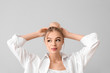 © Pixel-Shot - Portrait of beautiful young woman on grey background
