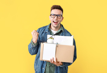 Wall Mural - Happy fired man on color background