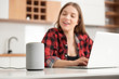© Proxima Studio - Woman talking to smart speaker. Smart home.