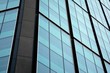 © Grand Warszawski - Abstract reflection of modern city glass facades. Modern office building detail, glass surface.