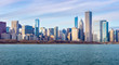 © nuinthesky - Chicago downtown skyline sunset Lake Michigan with most Iconic building from Adler Planetarium.