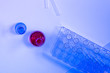 © Will Anderson - Pipette bottle red Blue Liquid Laboratory Virus test tube above