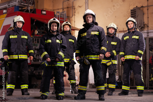 Six professional firefighters posing together Poster Mural XXL
