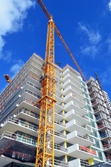 Luxury high-rise apartment buildings under construction.