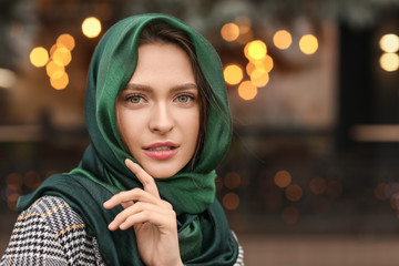 Wall Mural - Beautiful young woman with stylish scarf outdoors