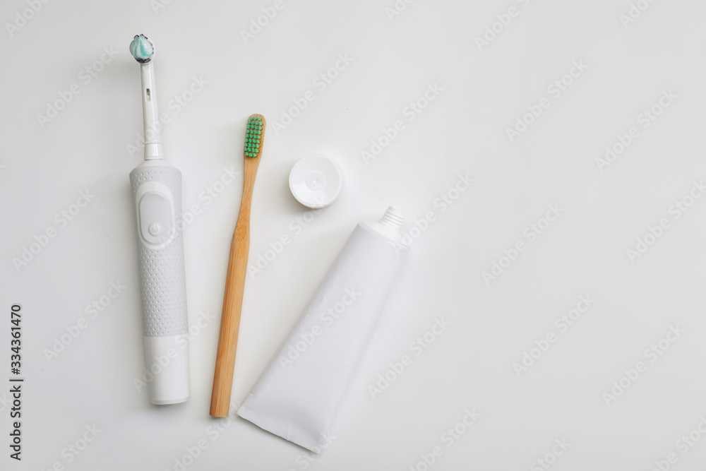 Tooth brushes with paste on white background
