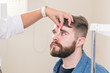 © satura_ - Medicine, health, ophthalmology concept - Ophthalmologist examines patient's eyes.