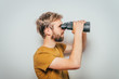 © aeroking - man with binoculars. gray background