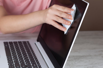 Woman cleaning computer