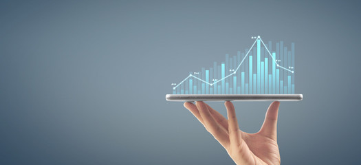  Graph growth and increase of chart positive indicators in his business,tablet in hand