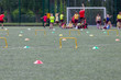 Children competing during school sports day in the UK. Blurred image with selective focus.