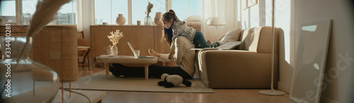 Cuadros en Lienzo Mother working from home, having a phone call, while her daughter distracts her