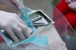© prokop.photo - Dental appliances in sterile packaging. Dentist's hand in gloves.