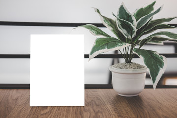 Wall Mural - Mock up acrylic frame posters pattern template forms background, blank menu frame on table in coffee shop stand for your text of display your product