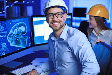 Portrait of male engineer in office at night