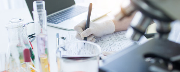 scientist searching and looking at microscope, doctor or researcher are researching antivirus corona