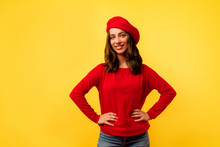 Inside Photo Of Young European Charming Lady With Short Hairstyle In Red Stylish Pullover And Beret Posing Over Yellow Background