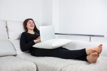 a teenage girl laughing while making a video call